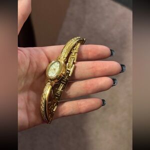 Elgin Women Analog Oval Gold Curved Bracelet Watch